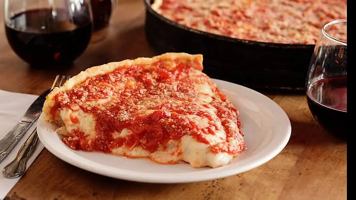 Lou Malnati's iconic Chicago deep-dish pizza slice